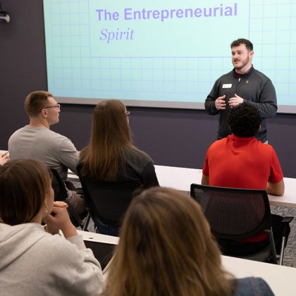 PCBD presenter speaking to students.