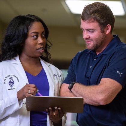 Clinician speaking with patient.