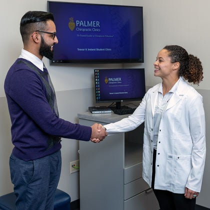Clinic D.C. greeting new patient.