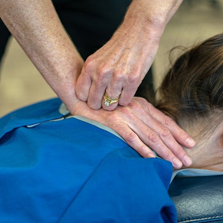 Research adjustment on patient.