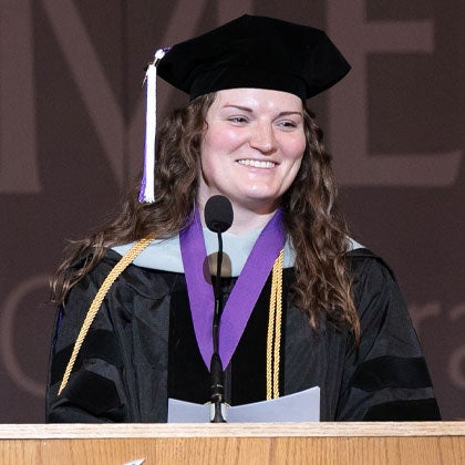 Student speaking at graduation.
