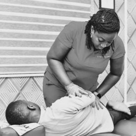 Naa Ashietey, D.C. ('11) adjusting a patient.