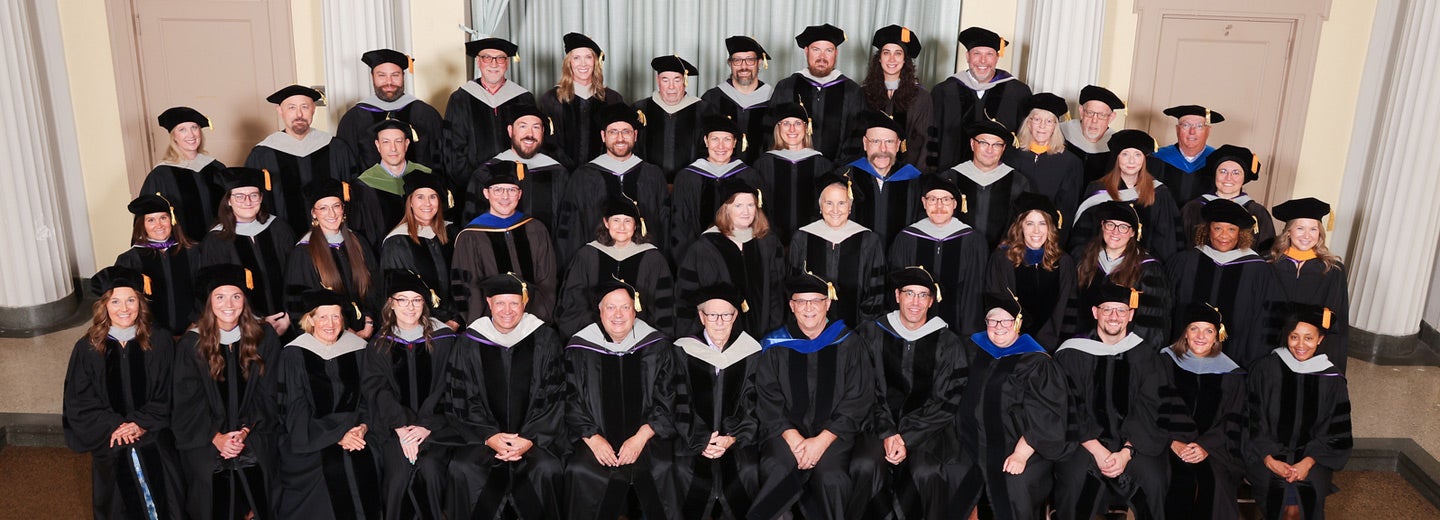 Palmer's Main graduation class 262 in hats and gowns.