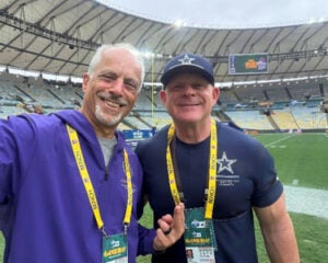 Dr. Sokoloff on the field wearing gameday badges.